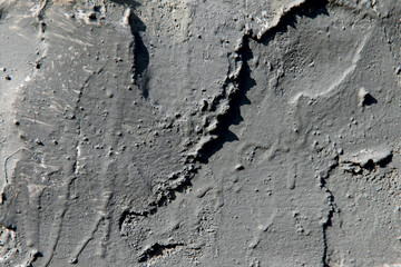 Background of the vertical surface of the wall, treated with cement mortar .. Texture, cropped shot, close-up, blurred, only, vertical