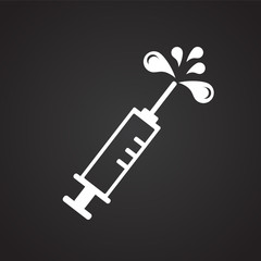 Syringe on black background icon