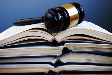 Law books and gavel in a court. Lawsuit and justice.