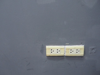 Power outlet on the wall.