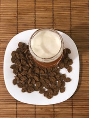 cup of coffee and beans on wooden table