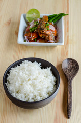 Spicy salad of canned sardines fish and cooked rice in bowl , meal of Thai food