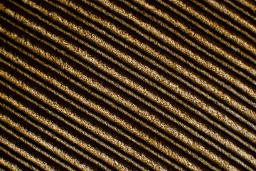 Texture of corduroy fabric. Velvet creates a textural background. Corduroy fabric for sewing clothes. Retro style.