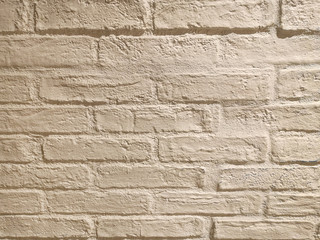beige brick wall in the evening light