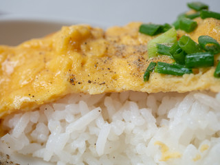 omlette with sausage on stream rice