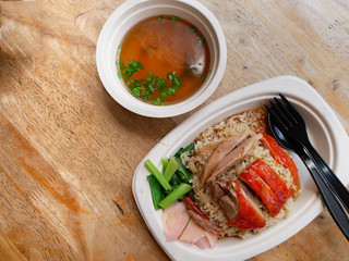 roasted duck over stream rice with soup on bagasse dish