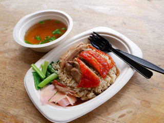 roasted duck over stream rice with soup on bagasse dish