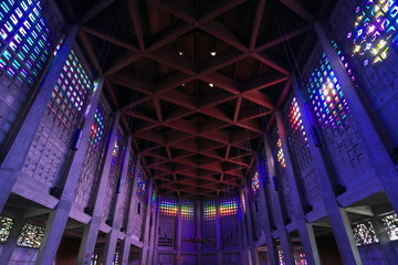 Baccarat,France-October 11, 2018: The interior of Saint Remy church in Baccarat illuminated by colorful crystals on the wall. 