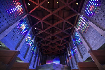 Baccarat,France-October 11, 2018: The interior of Saint Remy church in Baccarat illuminated by colorful crystals on the wall. 