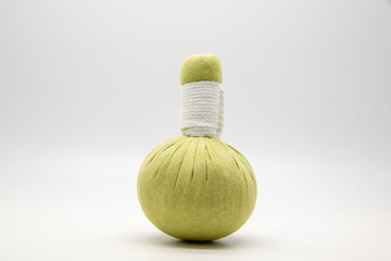 Green compress ball on white background.