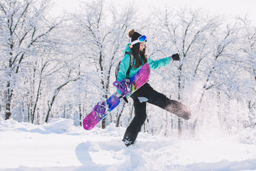 Fototapeta na wymiar Leisure, winter, sport concept - person snowboarder going up with board