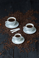 Coffee bean on wood and coffee cup is aroma