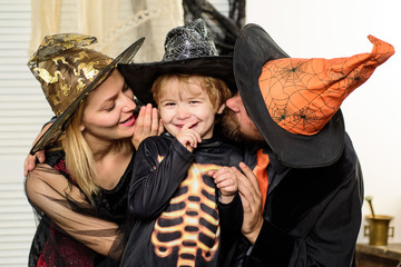 Family of wizards. Love for son, happy young parents. Halloween decoration and scary concept....