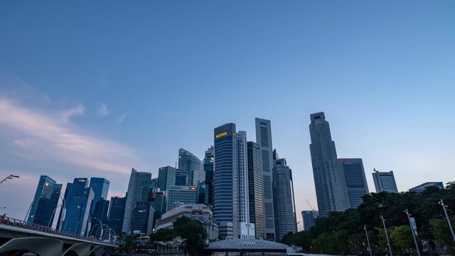 Singapore skyscrapers magic hour time lapse video - Tilt down