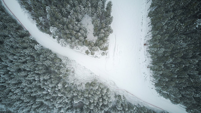 Aerial view of the ski slope in the mountains where skiers ride