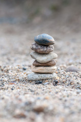 Fototapeta na wymiar Small balancing stones sitting on other rocks