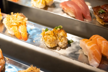 japanese sushi buffet on the counter bar in restaurant