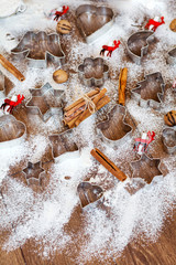 Fototapeta na wymiar Christmas food background with cookies molds and flour