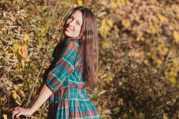 Portrait of Young Fashion Woman Outdoor on Autumn Background