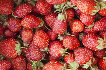 Raw ripe juicy red strawberry. Texture or background