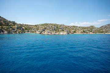 Fototapeta na wymiar Walk on the yacht by the blue sea. Magnificent sea tour and beautiful sea landscape