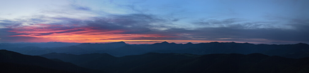 High resolution colorful sunset panorama, silhouette of the Chornohora mountain range of the Carpathians, Ukraine