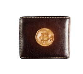 Gold bitcoin on wallet.