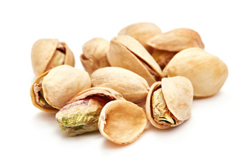 heap of pistachios isolated on white background