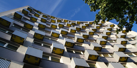 apartment building with a blue sky