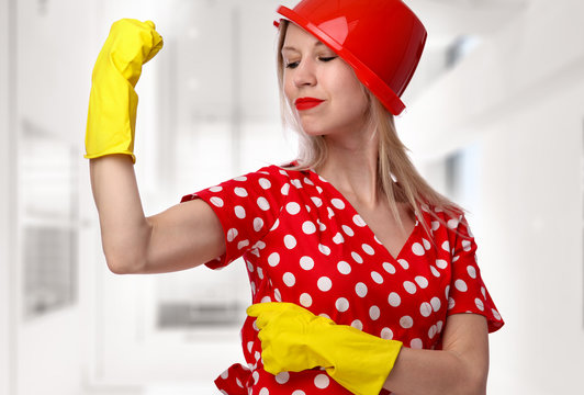 Feminism concept. Funny portrait of strong woman shoving her biceps