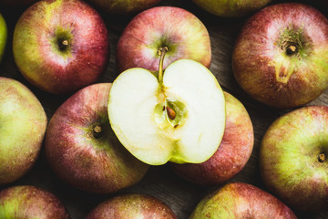 Fresh ripe apples on the wooden background. Selective focus. Shallow depth of field.