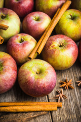 Fresh ripe apples on the wooden background. Selective focus. Shallow depth of field.