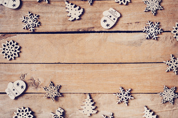 Wooden brown christmas background with snowflakes and christmas decoration.