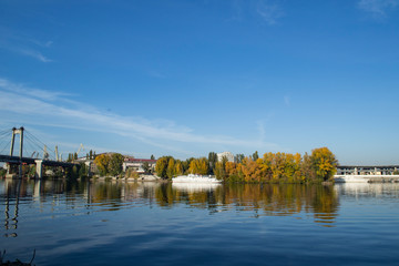 Fototapeta premium The yacht on the river near autumn park.