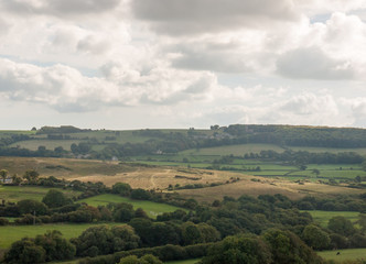 Obraz premium dorset corfe castle field view green landscape open summer day clouds weather clear nature village
