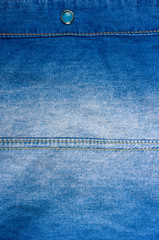 Blue washed faded jeans texture with seams