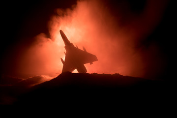 Air Crash. Burning falling plane. The plane crashed to the ground. Decorated with toy at dark fire background. Air accident concept.