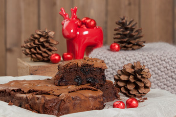 Fototapeta na wymiar Homebaked Chocolate And Cherry Brownie. Christmas Decorations.