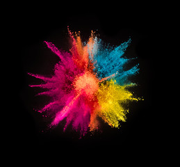 Colored powder explosion on black background