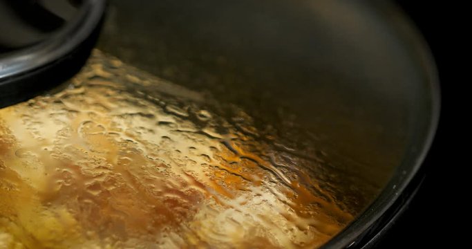 Asian chef cooking Chinese style Sichuan mapo tofu food in a hot pan
