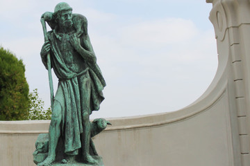 Bronze statue of the old man with lamb