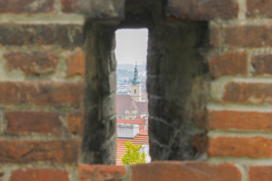 View of prague through brick window