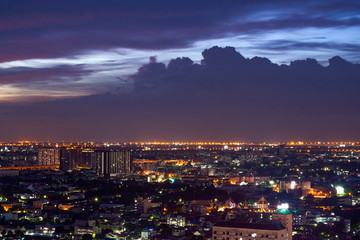aerial view from rooftop of cityscape on sunset twilight skyline