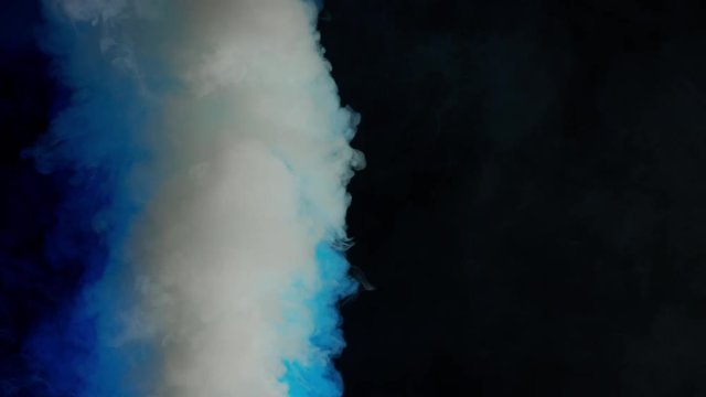 white and blue bomb smoke on black background