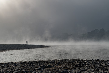 Fototapeta na wymiar Einsamkeit im Nebel über dem Rhein