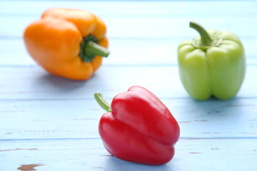 Colorful pepper on a blue background. Studio Photo