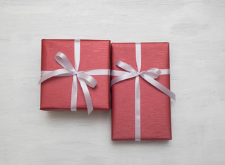 Two Red gift box with white ribbon isolated on white background.