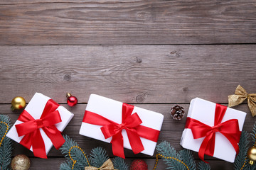 Christmas gifts presents with decorations on a grey background.