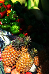 pineapples in sunlight an farmers market stall