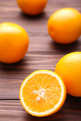 Ripe orange fruit on a brown background